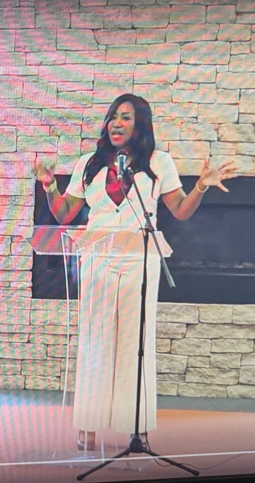 Delivering remarks at a lectern